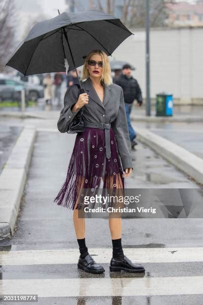 Elena Perminova wears grey belted jacket, burgundy skirt with